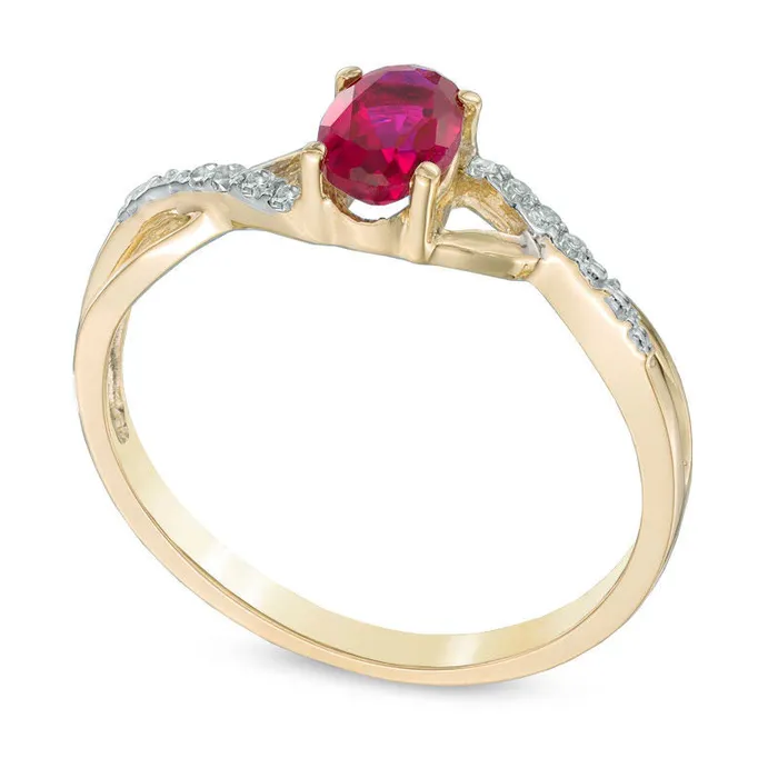 Rings Oval LabCreated Ruby and Diamond Accent Twist Engagement Ring in Solid 10K Yellow Gold Goldia Rings Oval LabCreated Ruby and Diamond Accent Twist Engagement Ring in Solid 10K Yellow Gold Goldia