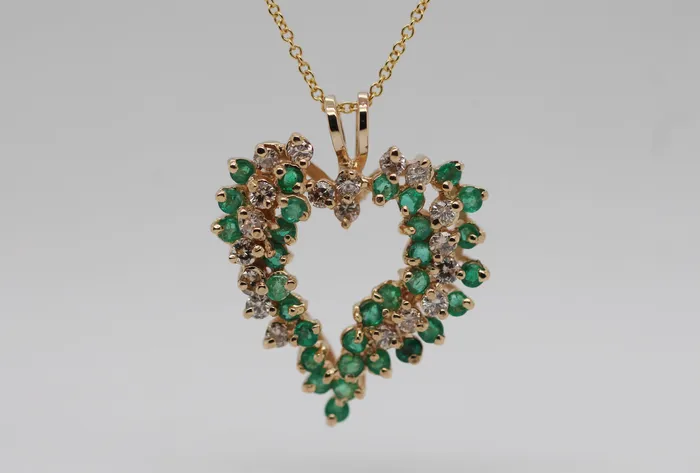 Estate 14KY 58 Cttw Emerald and Diamond Heart Pendant FULLERS PURCHASE FROM PUBLIC Necklaces Estate 14KY 58 Cttw Emerald and Diamond Heart Pendant FULLERS PURCHASE FROM PUBLIC Necklaces